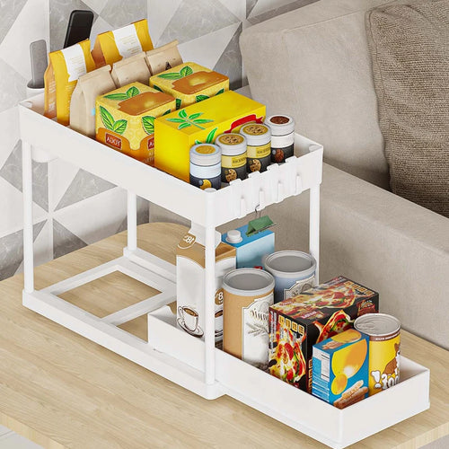 White two-tier organizer holding pantry items with the lower drawer pulled out